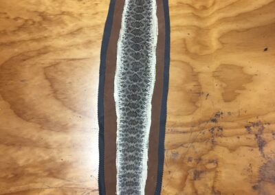Rattlesnake flat rug with leather backing